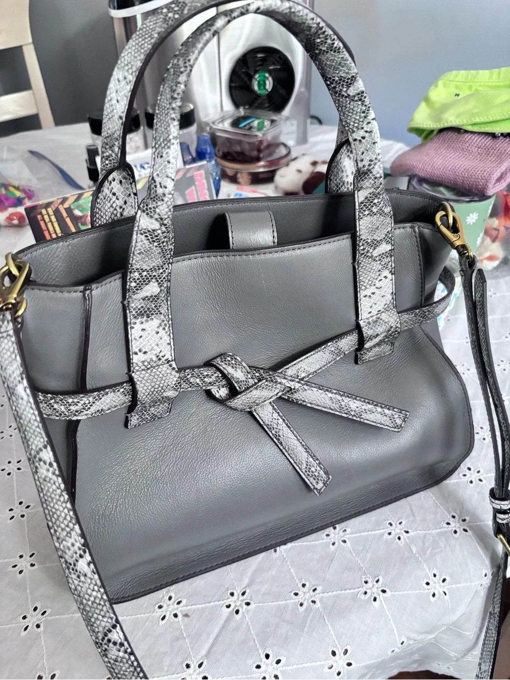 Fossil Willow satchel in gray leather, highlighted by a distinctive snake-print